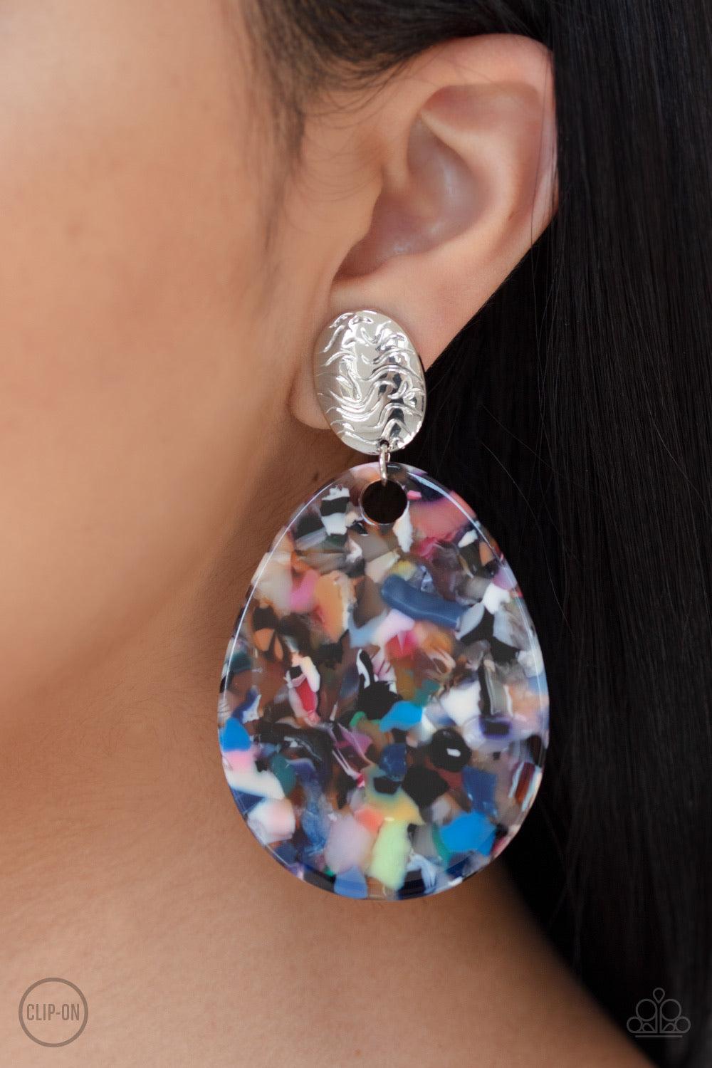 Paparazzi Accessories Confetti Collage - Multi *Clip-On Featuring a faux marble finish, a multicolored acrylic teardrop swings from the bottom of a swirly silver fitting, creating a colorful frame. Earring attaches to a standard clip-on fitting. Jewelry