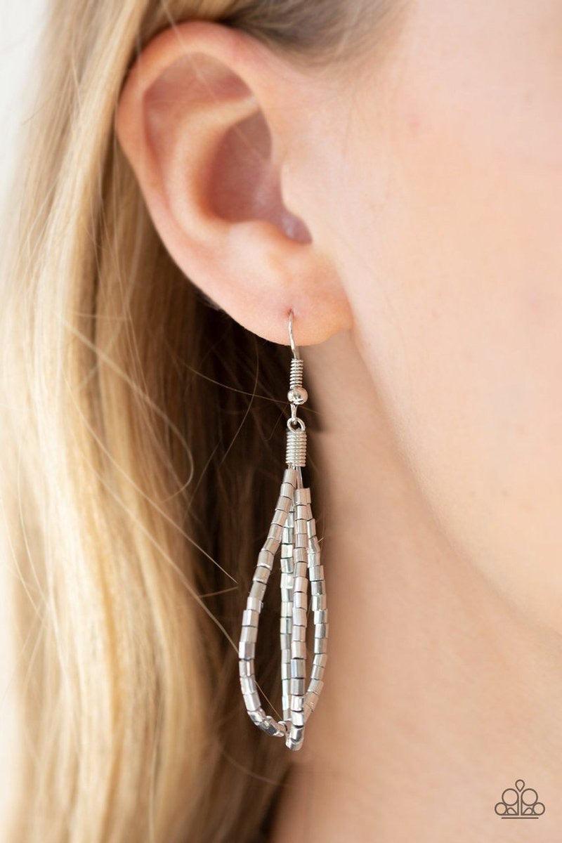 Paparazzi Accessories Catwalk Queen - Silver Strand after strand of metallic silver seed beads fall together to create a bold statement piece. Features an adjustable clasp closure.Sold as one individual necklace. Includes one pair of matching earrings. Je