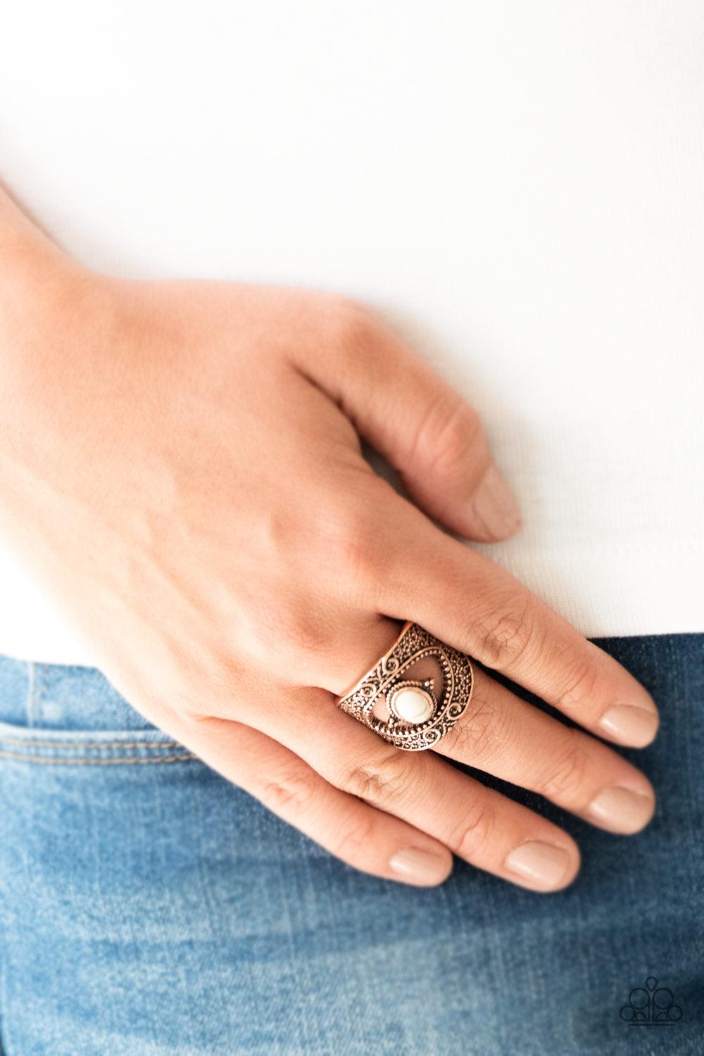 Paparazzi Accessories Rural Relic - Copper Embossed in shimmery filigree, glistening copper frames join around a refreshing white stone center for a seasonal look. Features a stretchy band for a flexible fit. Jewelry