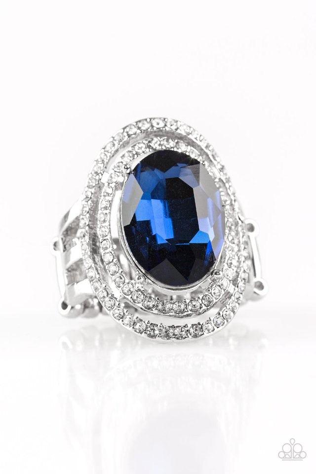 Paparazzi Accessories Making History - Blue A glittery blue gem sits atop stacked silver frames radiating with glassy white rhinestones for a timeless look. Features a stretchy band for a flexible fit. Jewelry