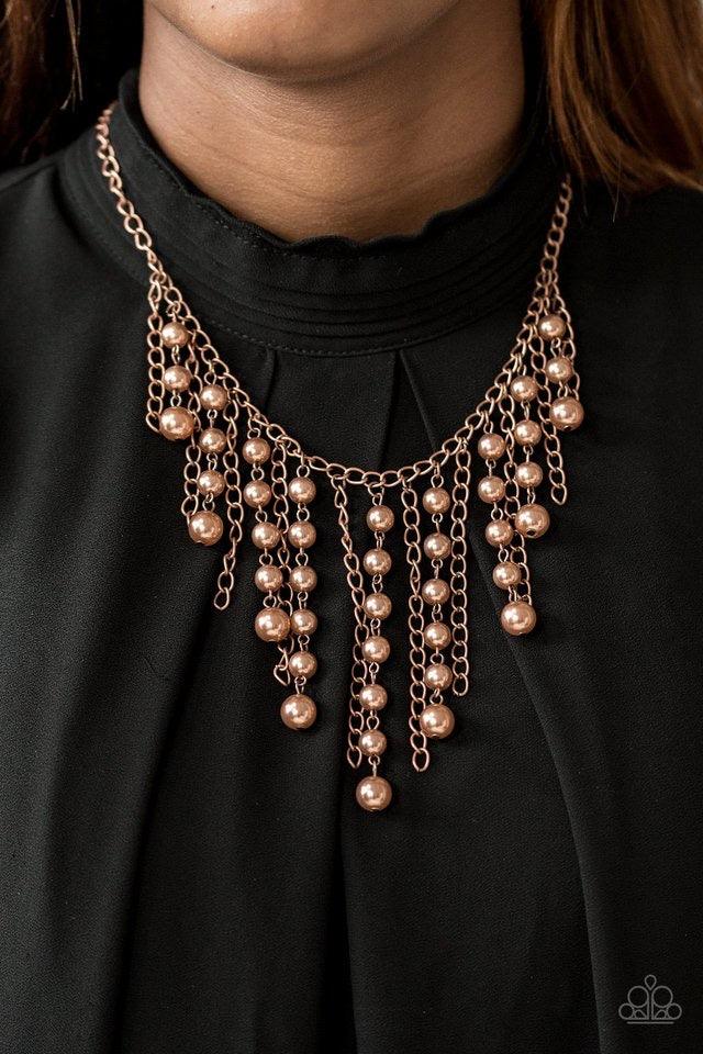 Paparazzi Accessories STUN Control - Copper Pearly copper beads trickle along strands of glistening copper chains, creating a tapered fringe below the collar. Features an adjustable clasp closure. Sold as one individual necklace. Includes one pair of matc