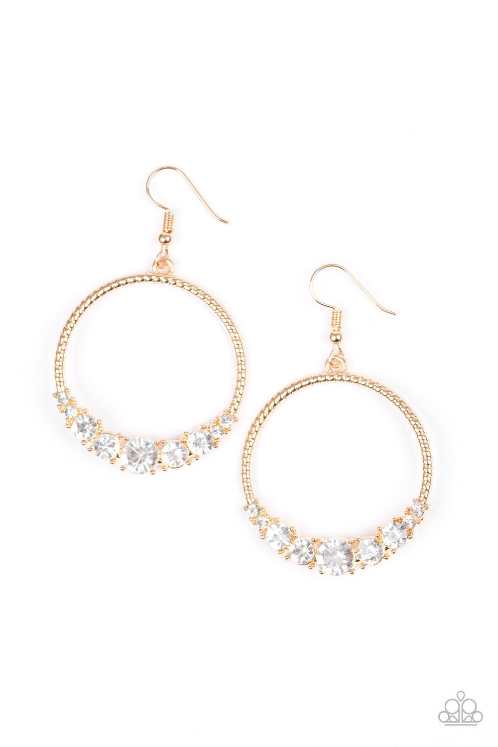 Paparazzi Accessories Self-Made Millionaire - Gold The bottom of a textured gold hoop is encrusted in glittery white rhinestones for a glamorous look. Earring attaches to a standard fishhook fitting. Sold as one pair of earrings. Jewelry