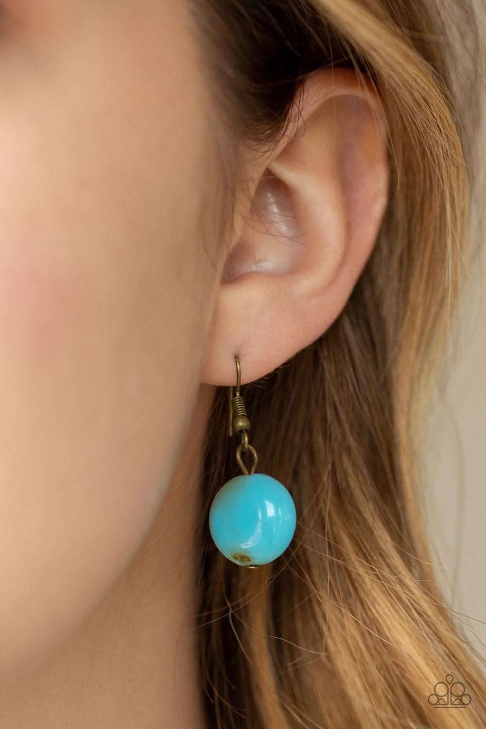 Paparazzi Accessories Full Out Fringe - Blue Featuring a smoky finish, a collection of blue acrylic beads and antiqued brass beads dangle from a classic brass chain, creating a flirtatiously clustered fringe below the collar. Features an adjustable clasp