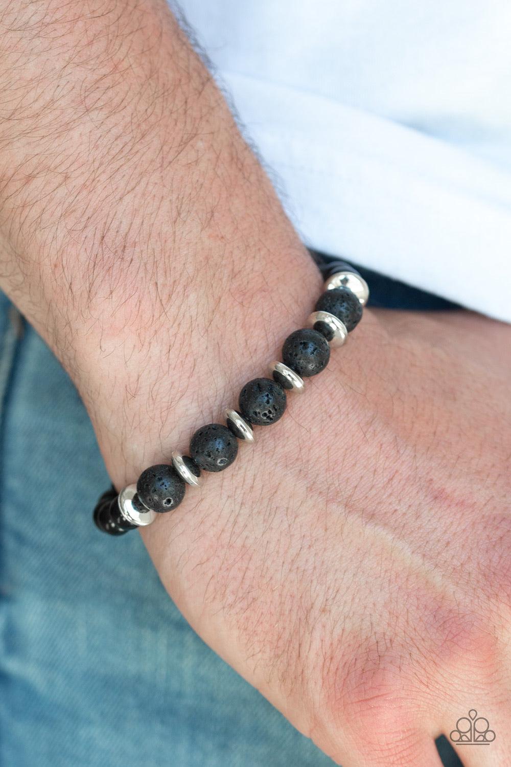 Paparazzi Accessories Truth ~Silver A collection of polished black beads, shimmery silver accents, and earthy lava rock beads are threaded along a stretchy band around the wrist for a seasonal look. Sold as one individual bracelet.