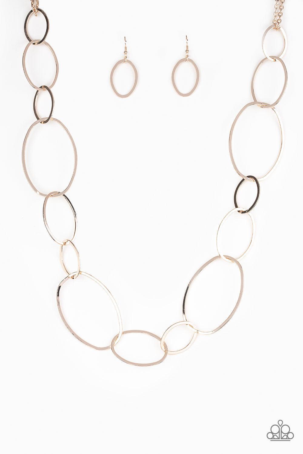 Paparazzi Accessories City Circuit - Gold Swinging from doubled rose gold chains, oversized asymmetrical hoops dramatically link across the chest for a refined industrial look. Features an adjustable clasp closure. Sold as one individual necklace. Include