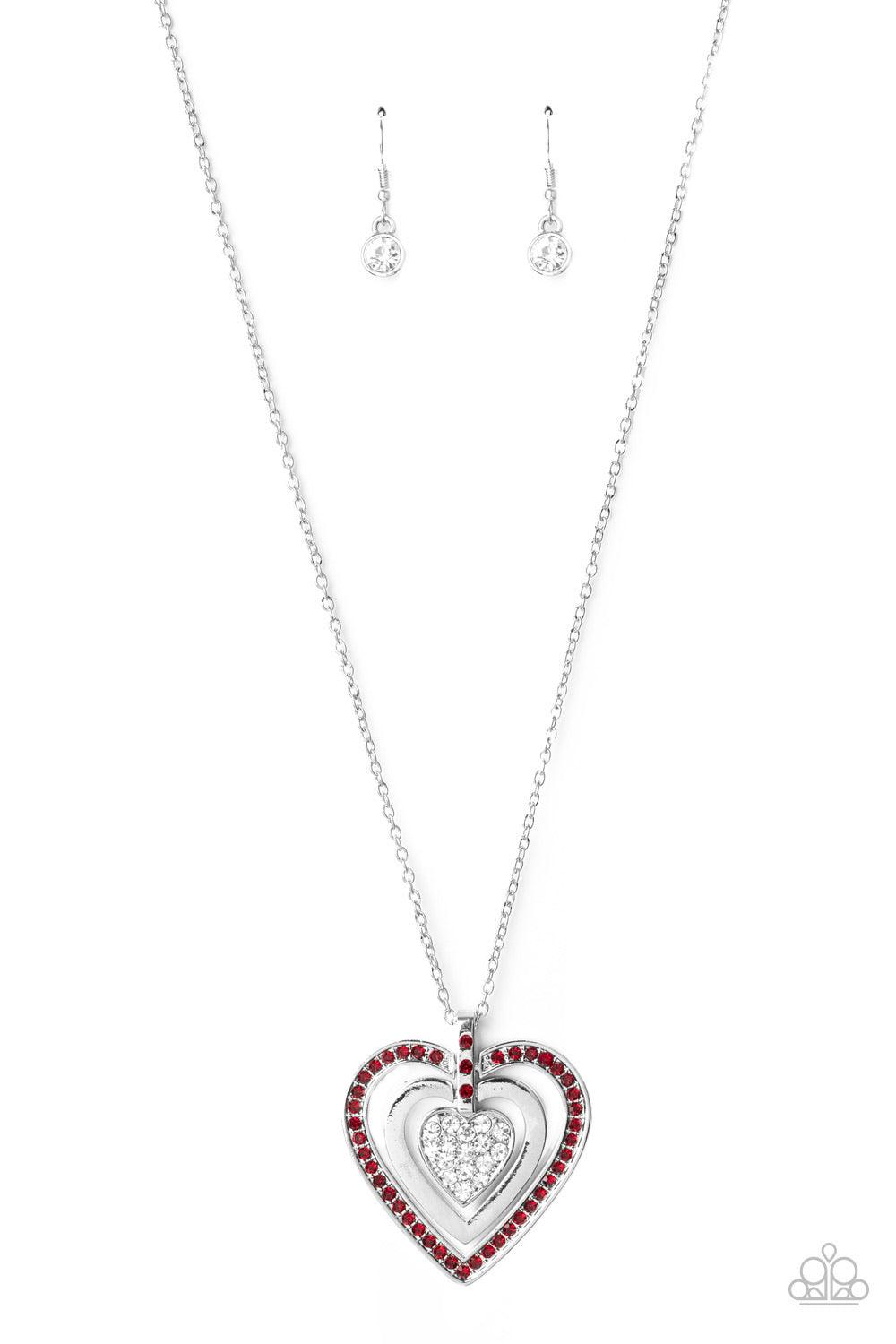 Paparazzi Accessories Bless Your Heart - Red A red rhinestone encrusted heart, shiny silver heart, and glittery white rhinestone encrusted heart swings from the bottom of a red rhinestone dotted fitting, creating a romantically oversized pendant below the