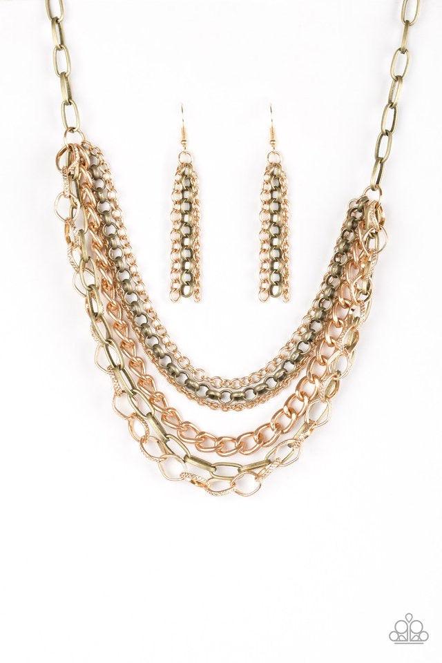 Paparazzi Accessories Word On The Street ~Brass Varying in size and shape, glistening brass and gold chains layer below the collar. Featuring smooth and textured links, the mixed metallic palette stacks into a collision of industrial shimmer for an edgy l