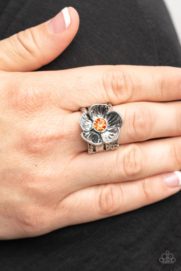 Paparazzi Accessories Prismatically Petunia - Orange Textured silver petals gently gather around a sparkling orange rhinestone center, blooming into a dazzling floral centerpiece atop the finger. Features a stretchy band for a flexible fit. Sold as one in