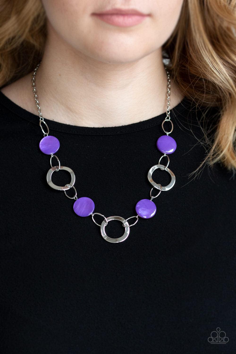 Paparazzi Accessories Bermuda Bliss - Purple Purple shell-like discs link with asymmetrical silver hoops below the collar for a colorfully seasonal look. Features an adjustable clasp closure. Jewelry