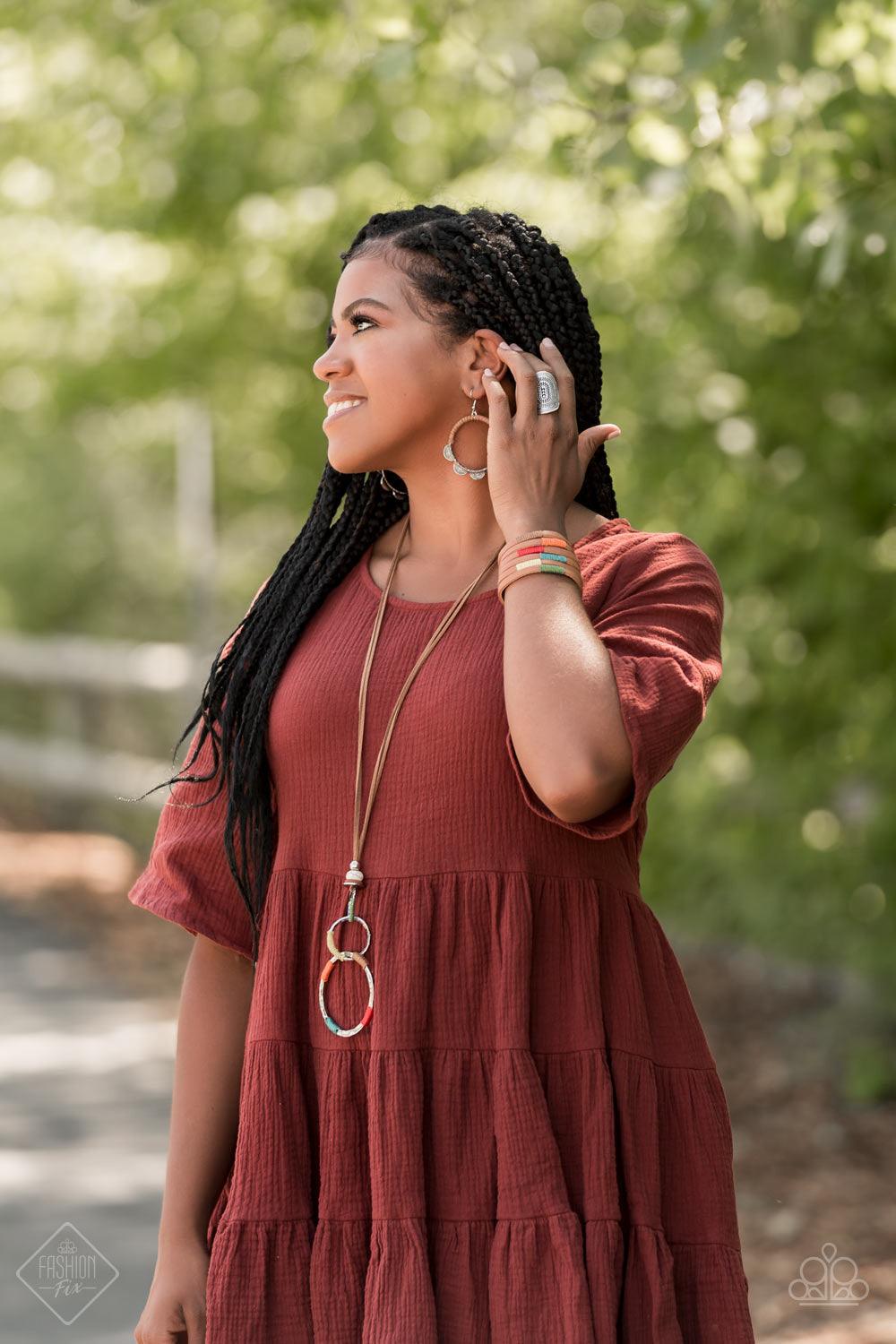 Paparazzi Accessories Country Colors - Multi A brown leather band has been spliced into layered rows that wrap around the wrist. Multicolored threaded accents wrap around the leather strips, creating a colorfully rustic display. Features an adjustable sna