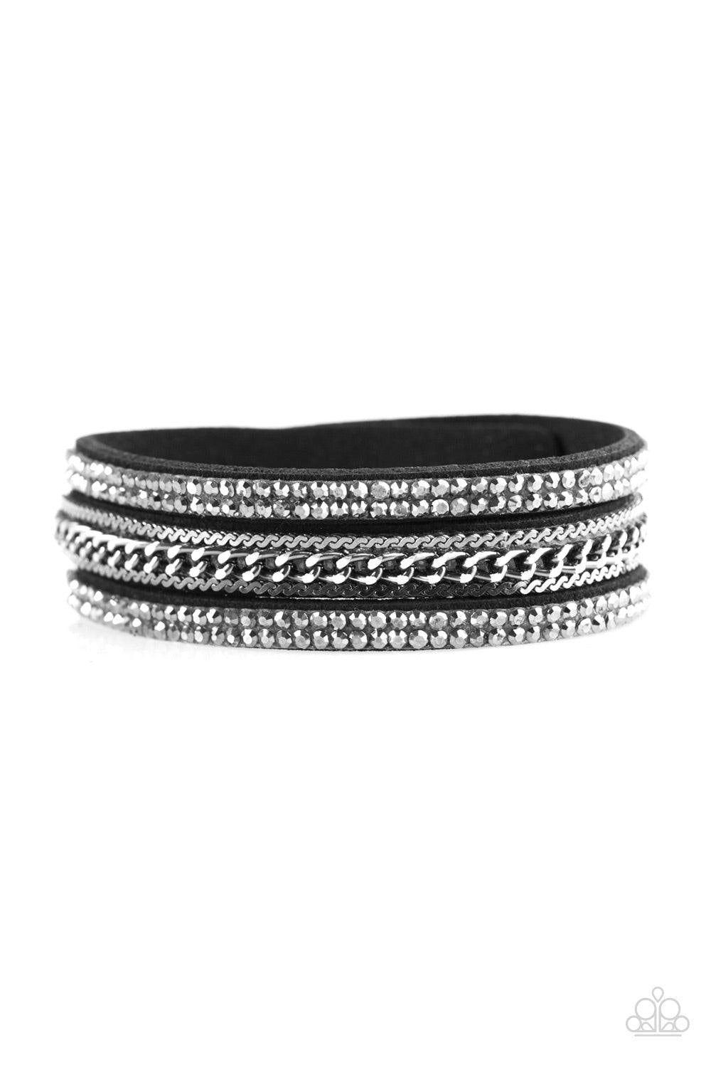 Paparazzi Accessories Unstoppable - Black Glittery hematite rhinestones and shimmery gunmetal chains are encrusted along strands of black suede, creating a mishmash of sassy shimmer around the wrist for a fierce look. Features an adjustable snap closure.