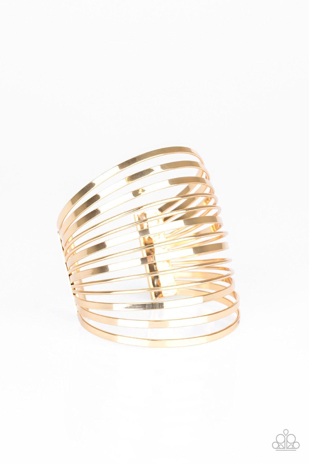 Paparazzi Accessories Front Line Shine - Gold Flat gold and dainty gold bars arc across the wrist, coalescing into a stacked cuff for a bold look. Jewelry