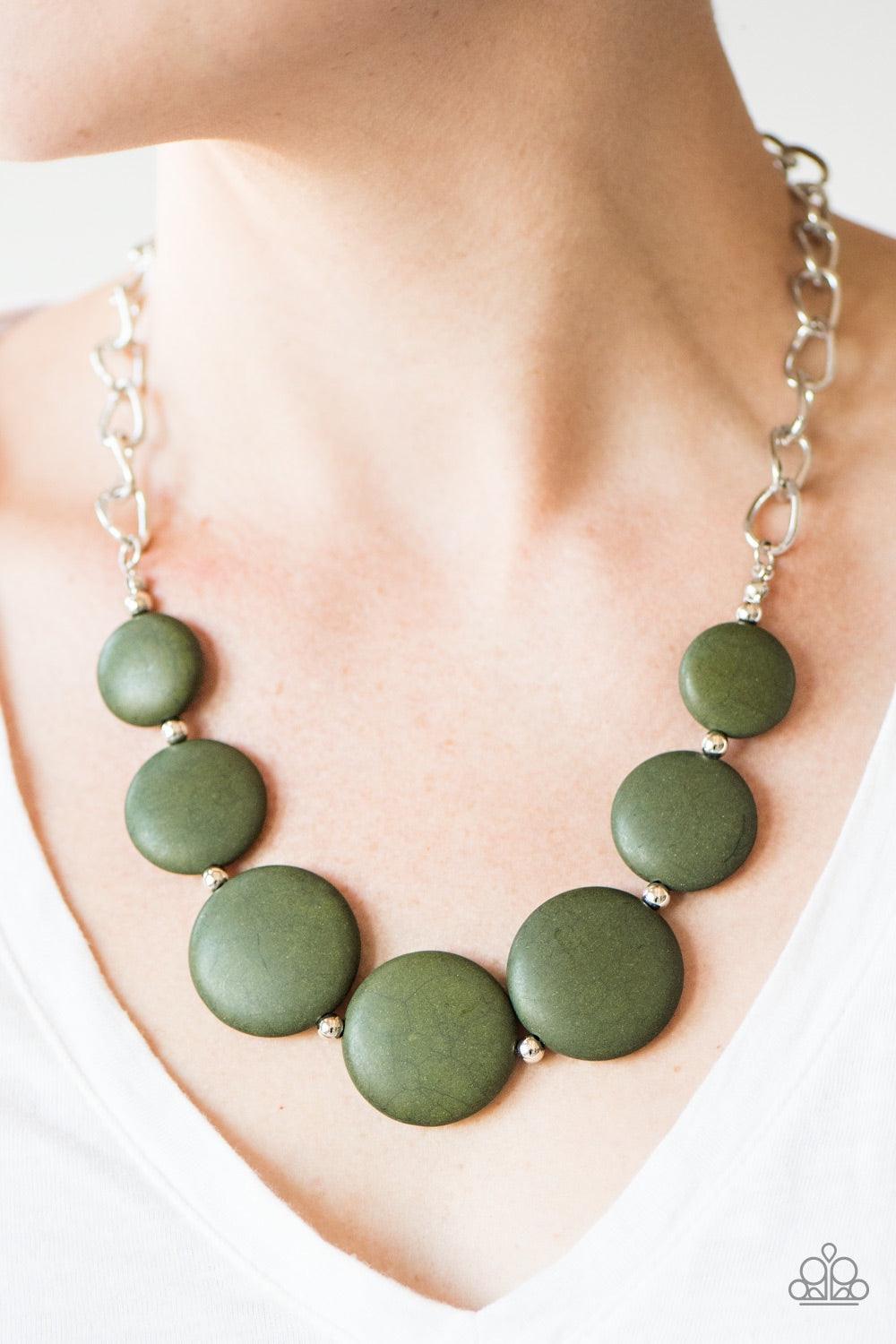Paparazzi Accessories Bedrock Betty - Green Flat green stones link below the collar in an earthy fashion. Dainty silver beads are sprinkled between the earthy stone accents, adding hints of shimmer to the bold artisanal palette. Features an adjustable cla
