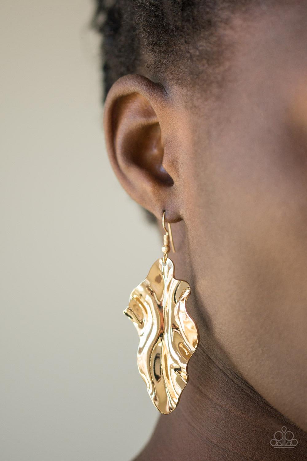 Paparazzi Accessories Fall Into Fall - Gold Brushed in a high-sheen finish, a rippling gold leaf-like frame falls from the ear for a seasonal look. Earring attaches to a standard fishhook fitting. Sold as one pair of earrings. Jewelry