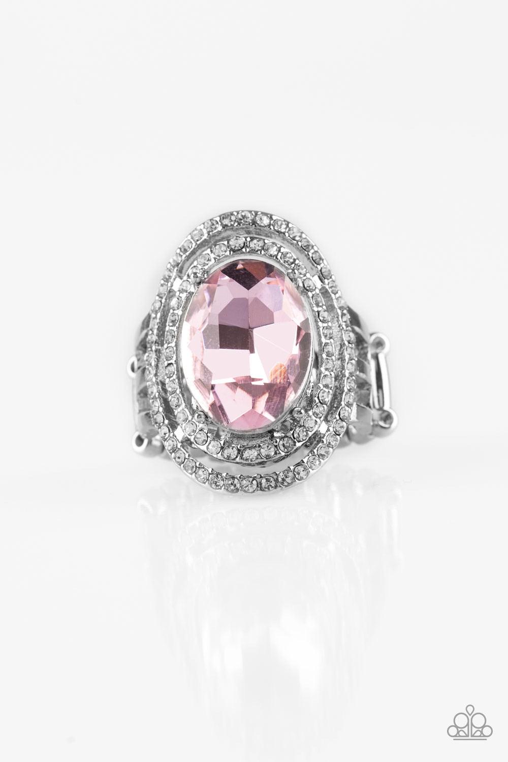 Paparazzi Accessories Making History - Pink A glittery pink gem sits atop stacked silver frames radiating with glassy white rhinestones for a timeless look. Features a stretchy band for a flexible fit. Sold as one individual ring. Jewelry