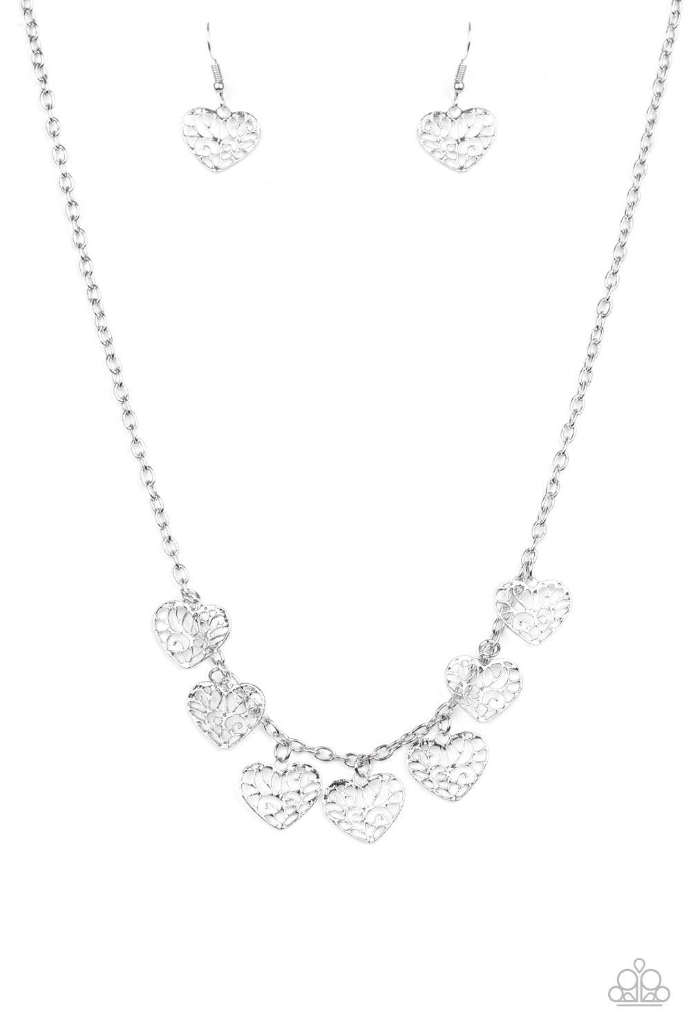 Paparazzi Accessories Less is AMOUR - Silver Infused with vine-like filigree filled centers, dainty silver hearts swing from the bottom of a shimmery silver chain below the collar for a whimsical look. Features an adjustable clasp closure. Sold as one ind