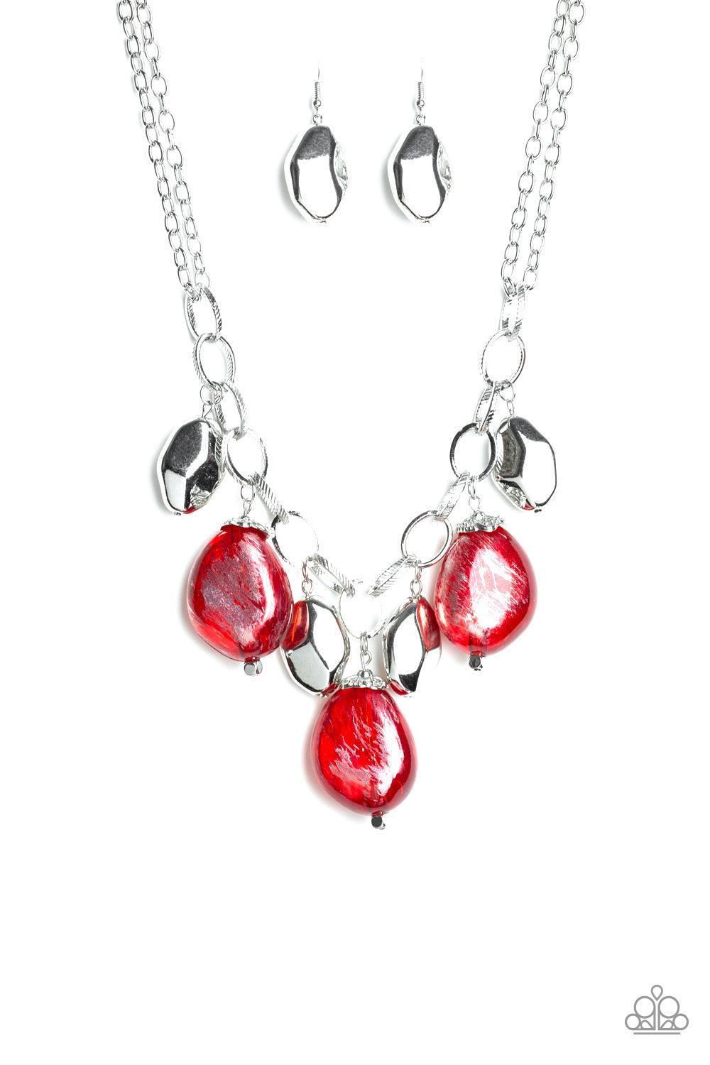 Paparazzi Accessories Looking Glass Glamorous - Red Brushed in a metallic shimmer, oversized glassy red beads and faceted silver beads dangle from the bottom of an oversized silver chain below the collar for a dramatic fringe. Features an adjustable clasp