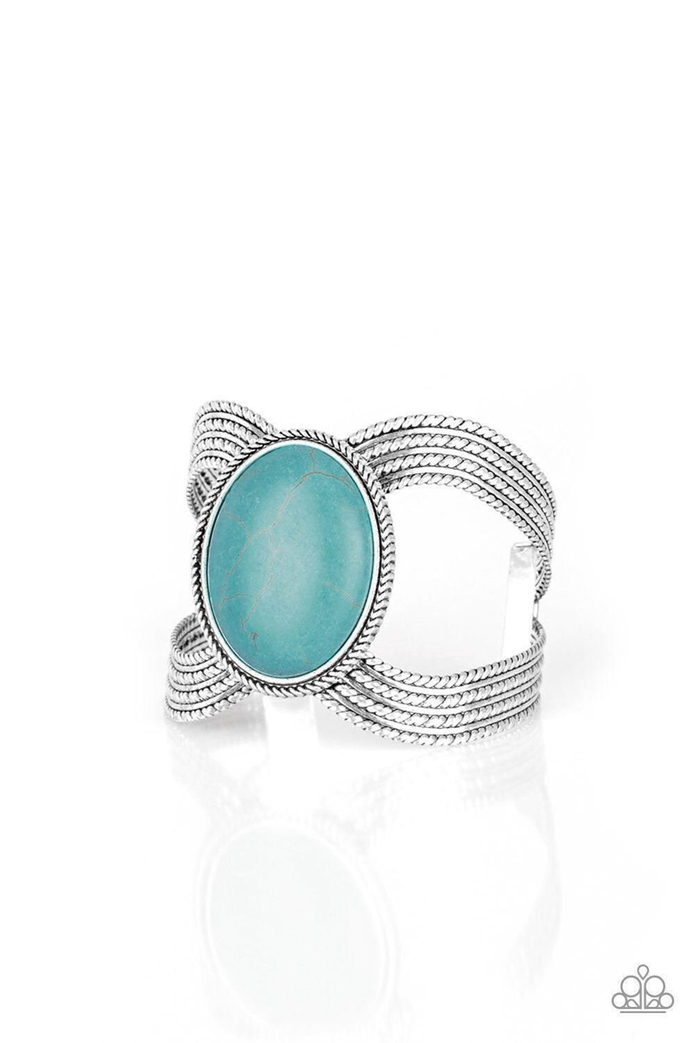 Paparazzi Accessories Coyote Couture - Blue A dramatic turquoise stone pendant is pressed into the center of textured silver bars, creating a bold seasonal cuff. Sold as one individual bracelet. Jewelry
