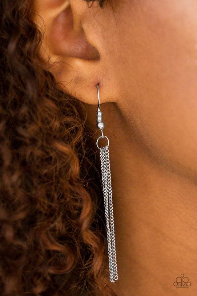 Paparazzi Accessories Sonoran Storm - Silver Gradually increasing in size, asymmetrical silver teardrops drip down the chest, creating rustic layers. The glistening teardrops are etched and studded down the center, adding tactile texture to the tribal ins