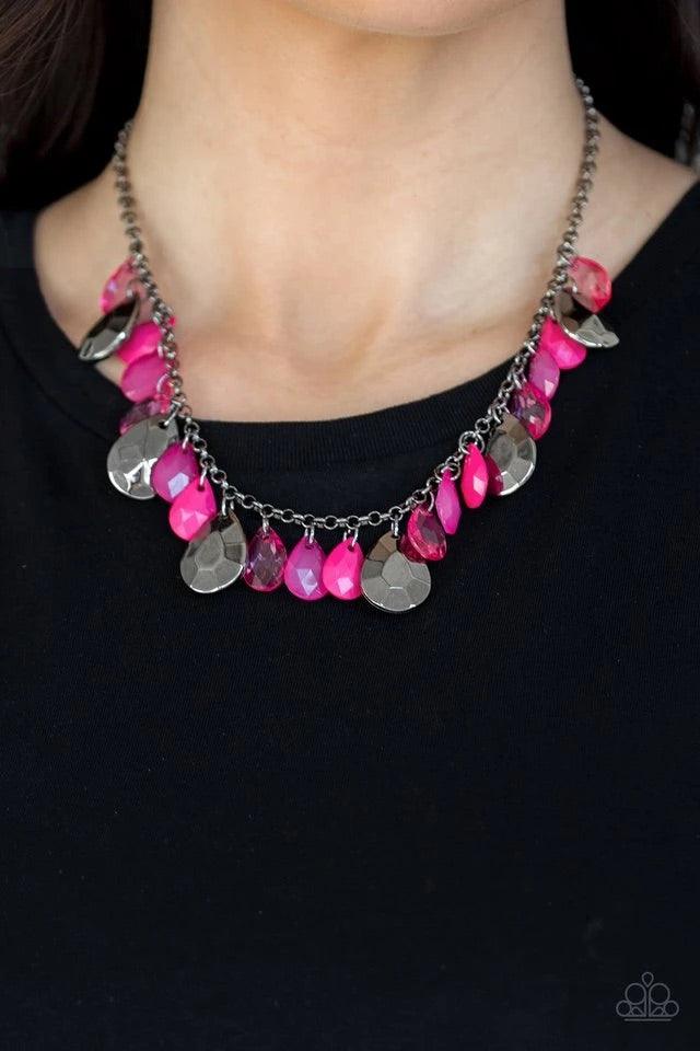 Paparazzi Accessories Hurricane Season - Pink Glassy and polished pink teardrops drip from the bottom of a shimmery gunmetal chain. Faceted gunmetal teardrops trickle between the colorful beading, adding a flashy finish to the flirtatious fringe. Features