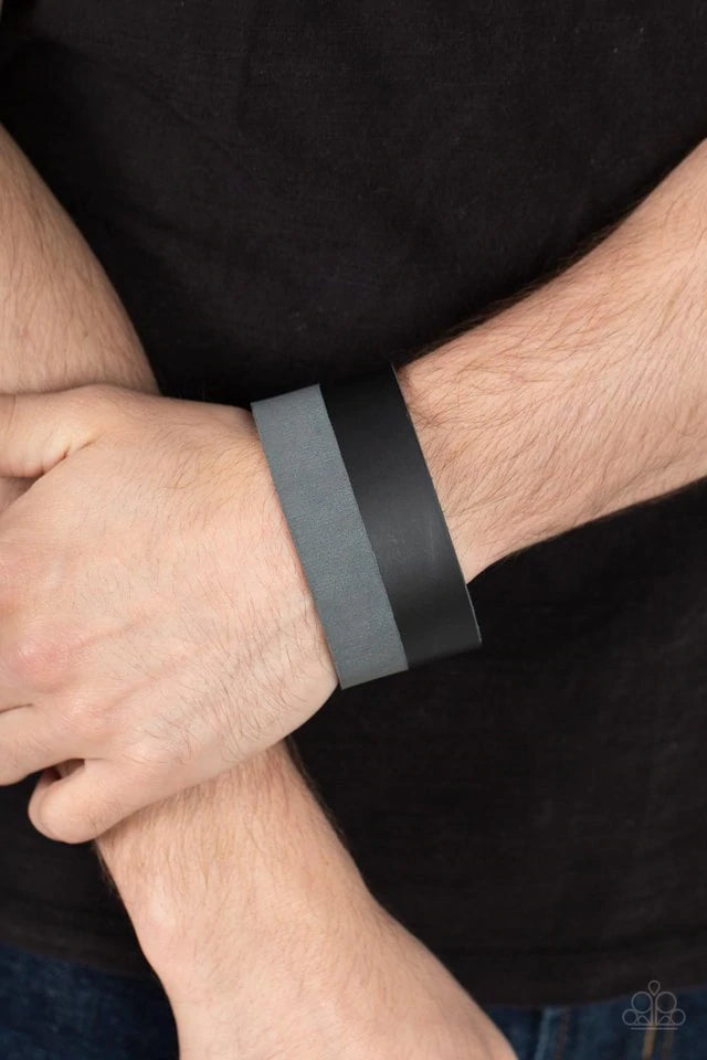 Paparazzi Accessories MOUNTAIN MAN to MOUNTAIN MAN - Black Edgy layers of black and gray leather wrap around the wrist for a down-to-earth fashion. Features an adjustable snap closure. Jewelry