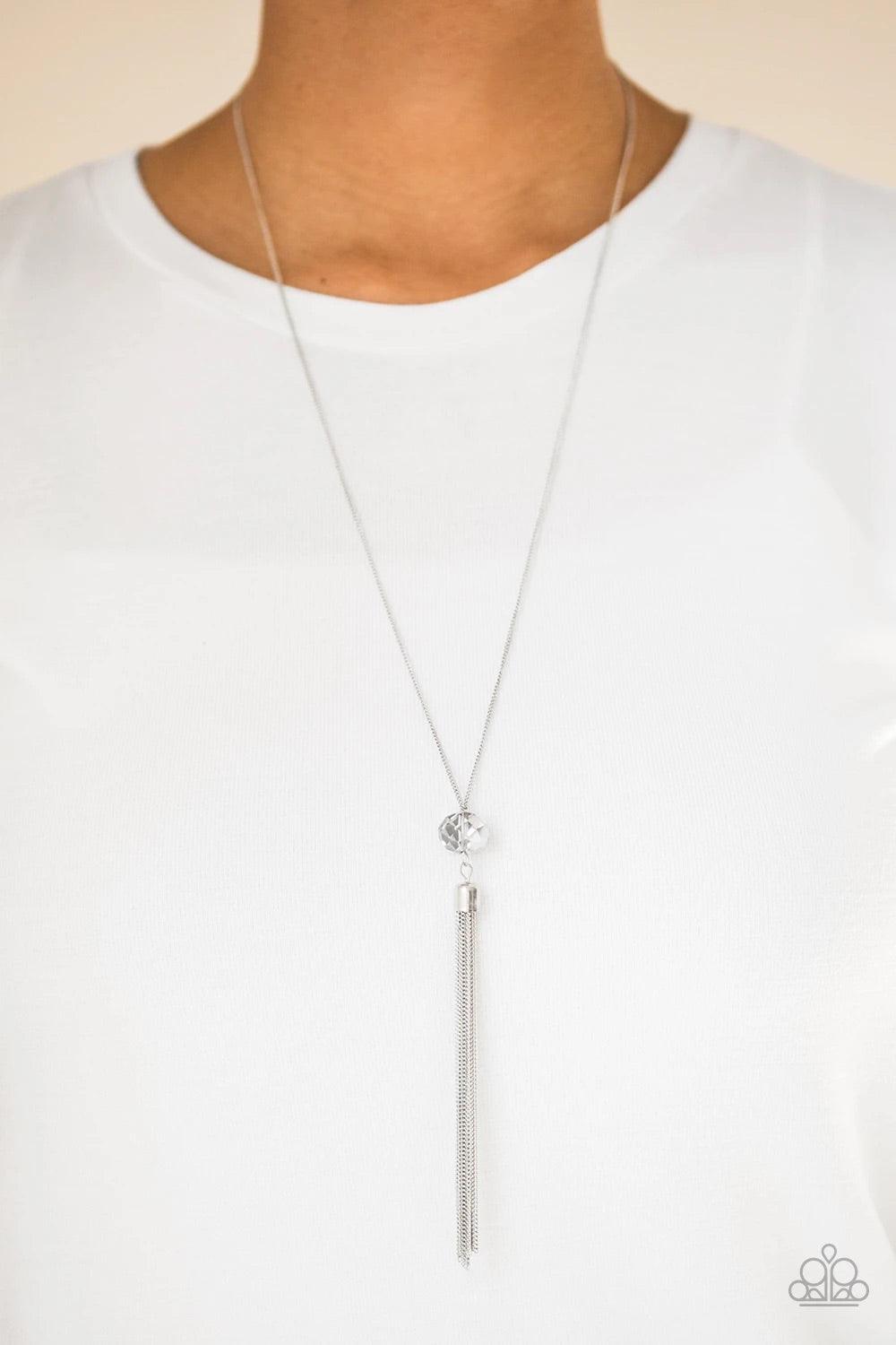 Paparazzi Accessories Socialite of the Season - Silver Splashed in metallic shimmer, a smoky crystal-like bead swings from the bottom of a lengthened silver chain, giving way to a shimmering silver tassel for a glamorous finish. Features an adjustable cla