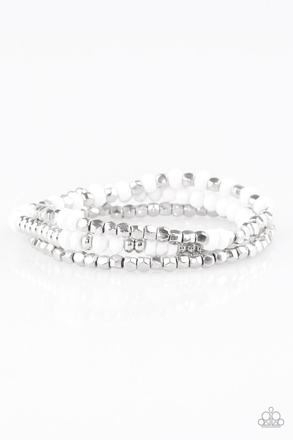 Paparazzi Accessories Very Vivacious ~White A mishmash of faceted white and silver beads are threaded along stretchy elastic bands, creating colorful layers across the wrist. Sold as one set of three bracelets.