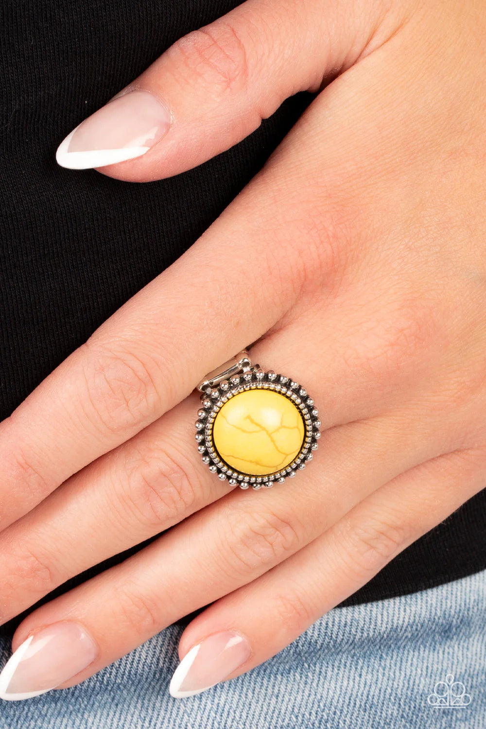 Paparazzi Accessories Messa Mecca - Yellow A round Daffodil stone bursts from a dainty border of textured silver. An outer ring of rustic silver studs radiates around the design, adding an authentic flair to the artisan-inspired centerpiece. Features a st