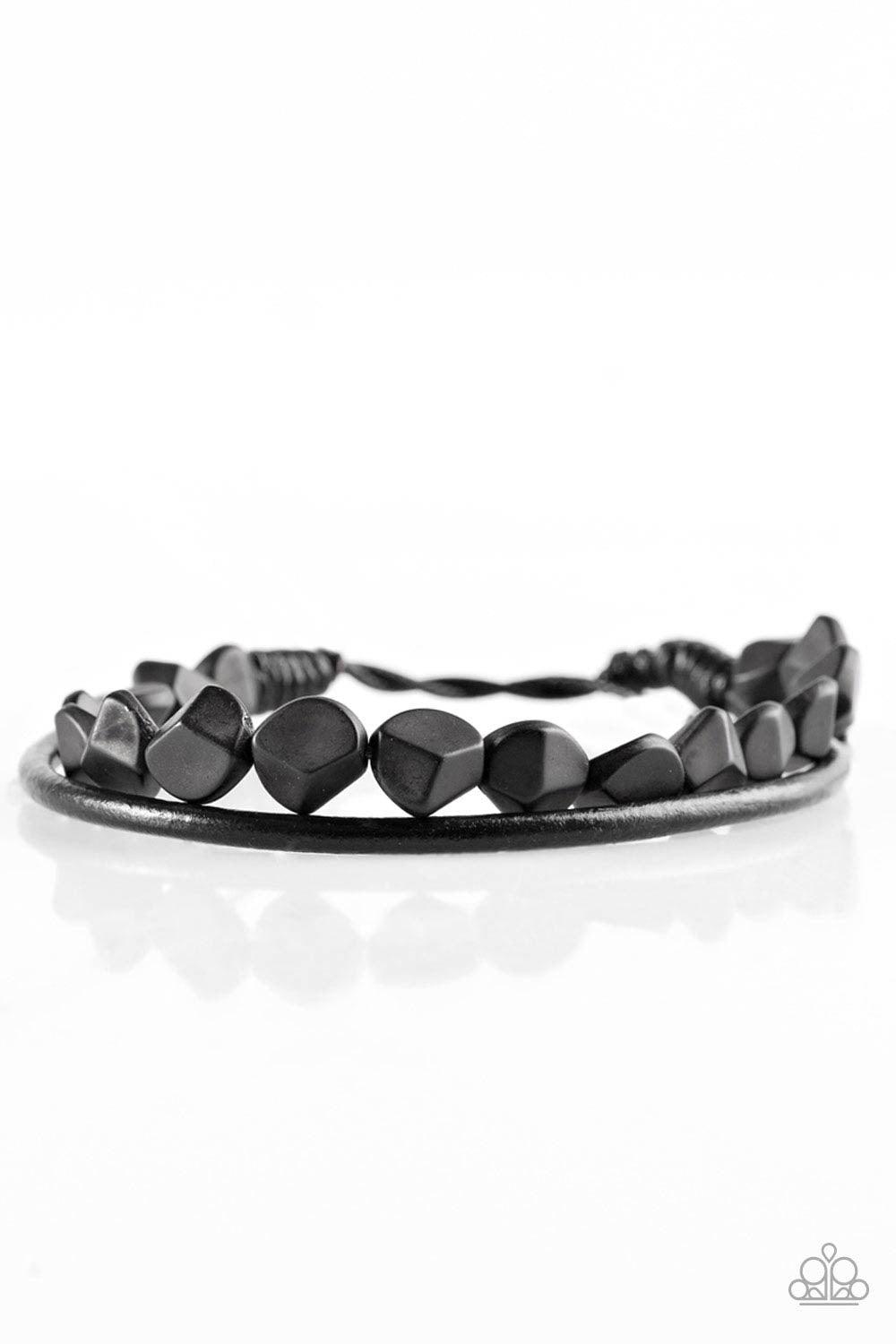 Paparazzi Accessories Treasure Trail - Black A strand of faceted black beads and a strand of shiny leather cording wrap around the wrist, creating dainty layers. Features an adjustable sliding knot closure. Jewelry