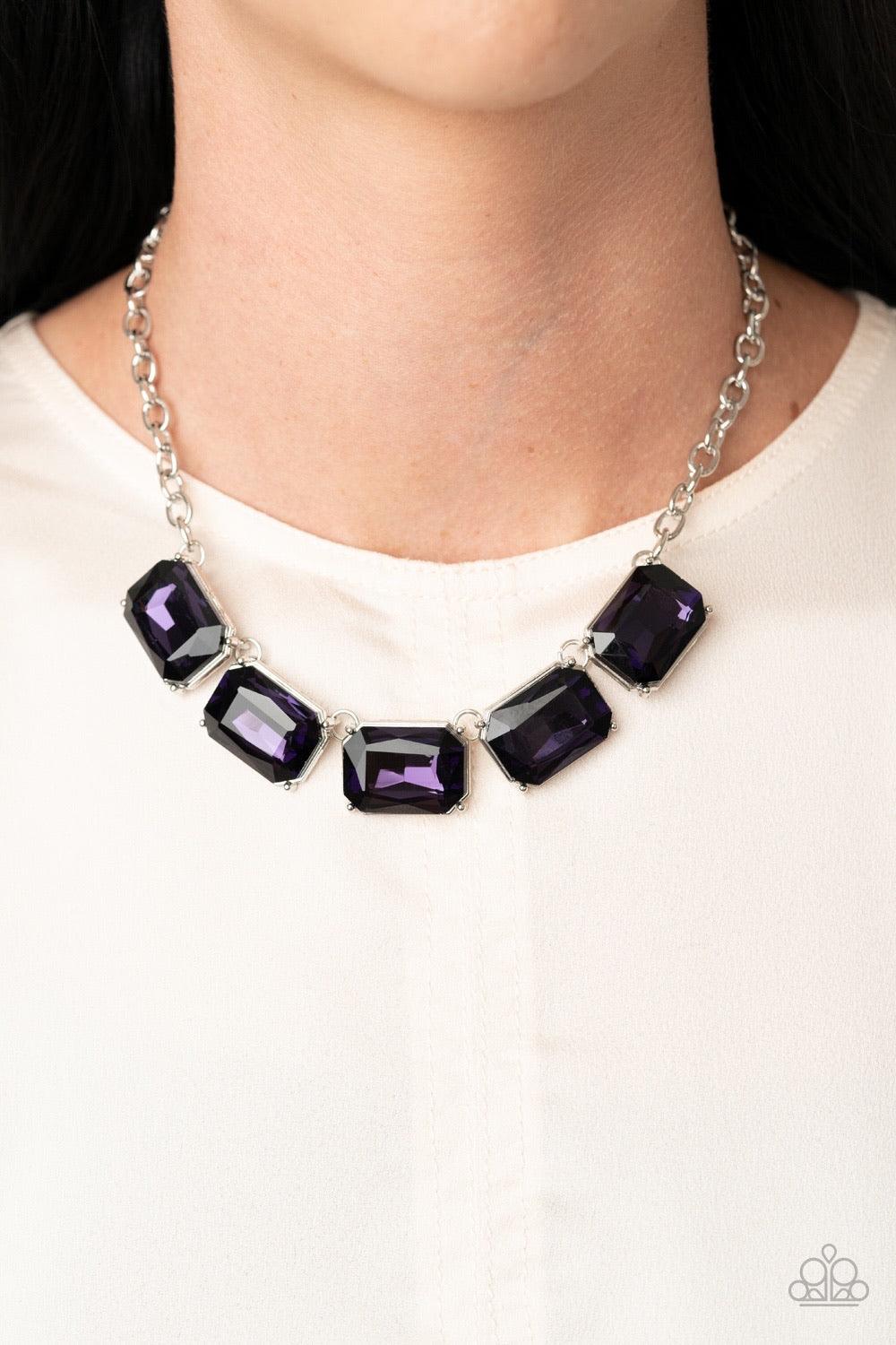Paparazzi Accessories Deep Freeze Diva - Purple Deep Freeze Diva - Purple P2ST-PRXX-080XX Featuring regal emerald style cuts, an oversized collection of purple rhinestones dramatically link below the collar for an icy finish. Features an adjustable clasp