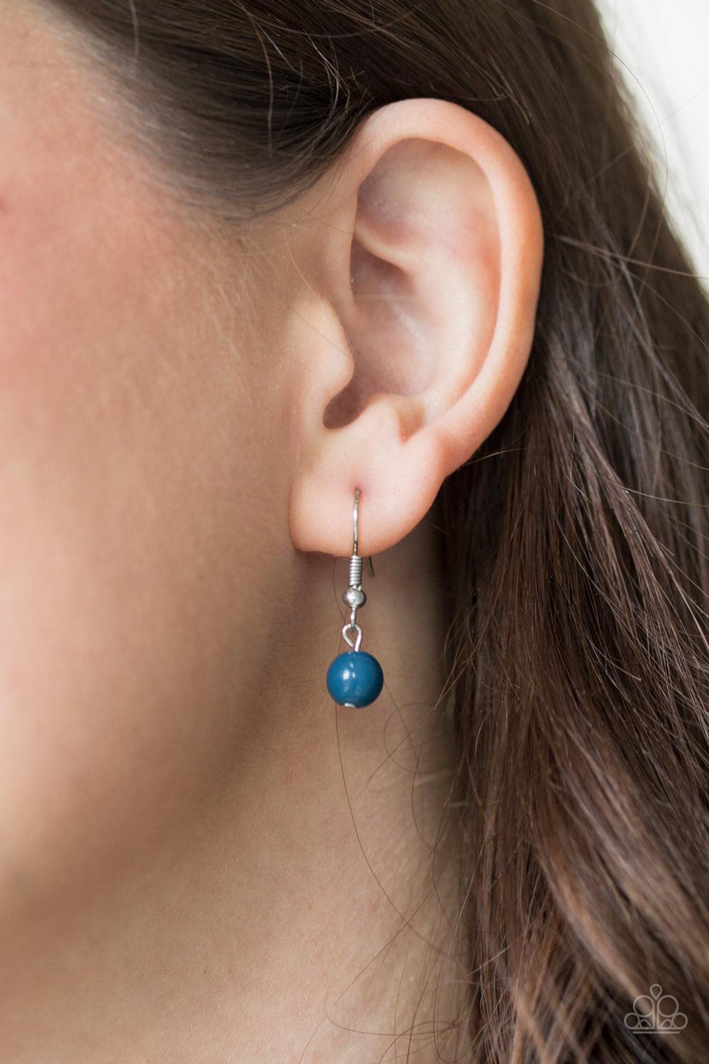Paparazzi Accessories Inde-PENDANT Idol - Blue Infused with a lengthened silver chain, a polished blue bead is pressed into the center of a flared silver pendant for a bold tribal flair. Features an adjustable clasp closure. Sold as one individual necklac