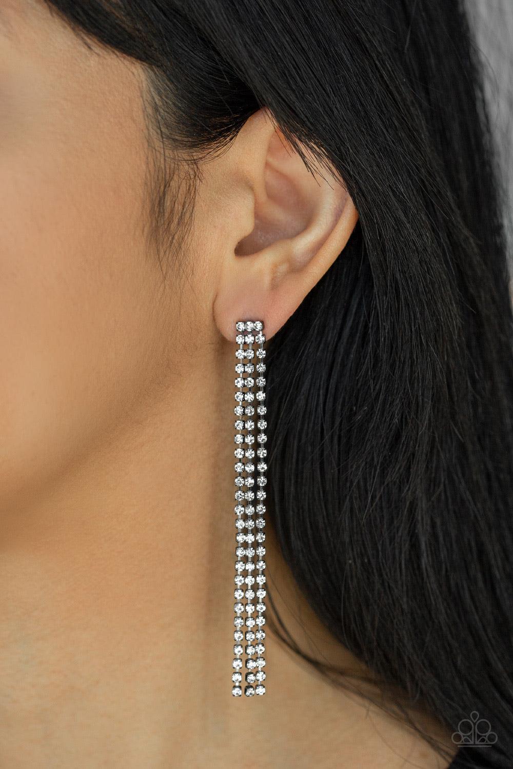 Paparazzi Accessories Stellar Starlight - Black Three strands of glittery white rhinestones free-fall from the ear, coalescing into a timeless chandelier. Earring attaches to a standard post fitting. Sold as one pair of post earrings. Jewelry