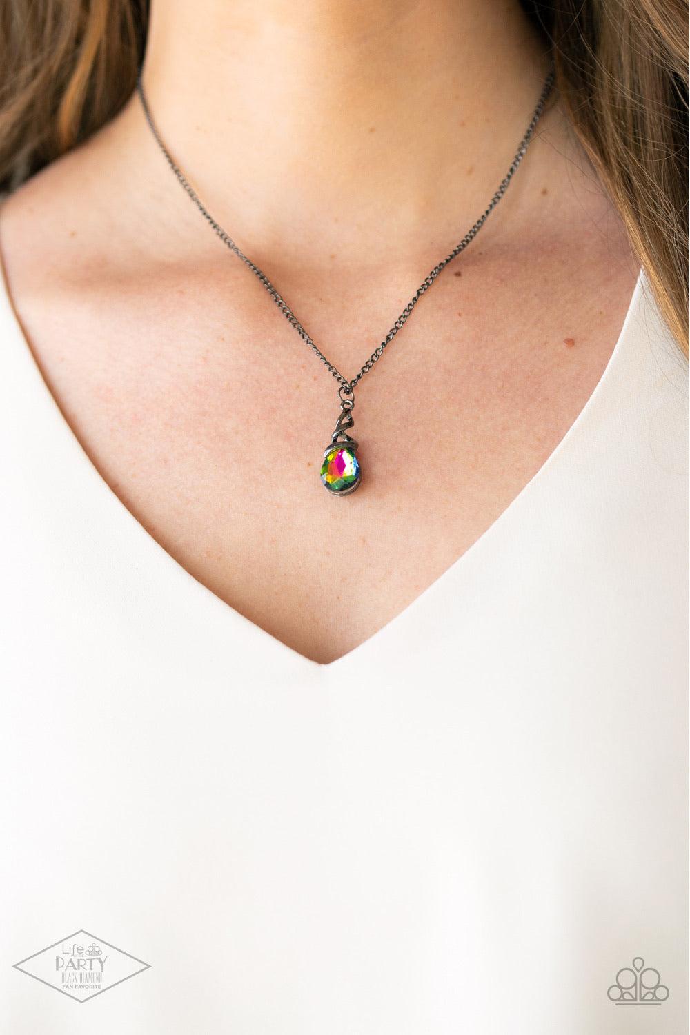 Paparazzi Accessories Timeless Trinket - Multi A shimmery gunmetal wire-like frame wraps around the top of a glittery rainbow teardrop gem, creating a timeless pendant below the collar. Features an adjustable clasp closure. Sold as one individual necklace