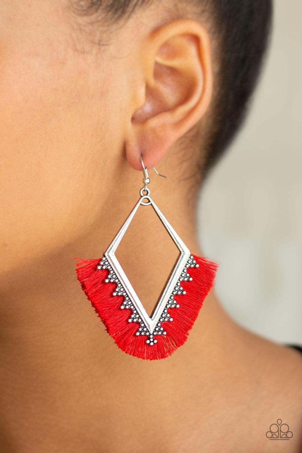 Paparazzi Accessories When in Peru - Red A fan of shiny red thread flares out from the bottom of a kite-shaped silver frame radiating with studded details for a flirtatious look. Earring attaches to a standard fishhook fitting. Jewelry