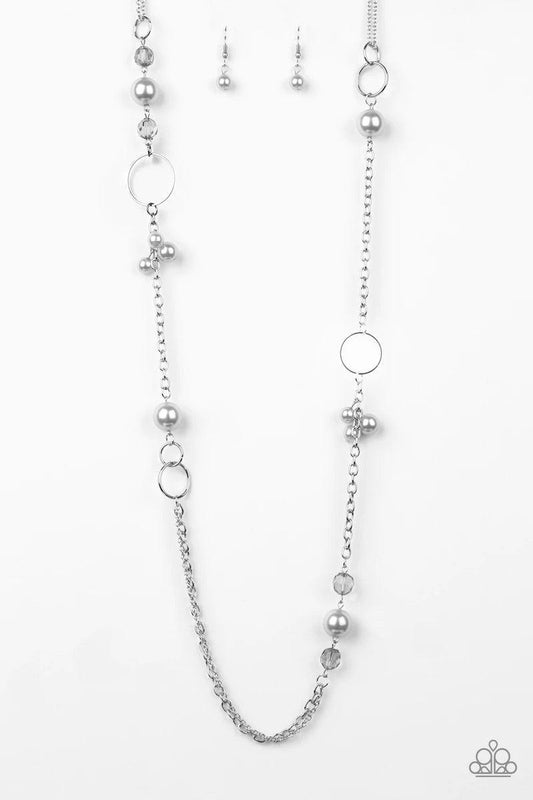 Paparazzi Accessories Pageant Princess - Silver A collection of glistening silver hoops, smoky beads, and pearly silver beads trickle along a shimmery silver chain for a refined look. Features an adjustable clasp closure. Sold as one individual necklace.