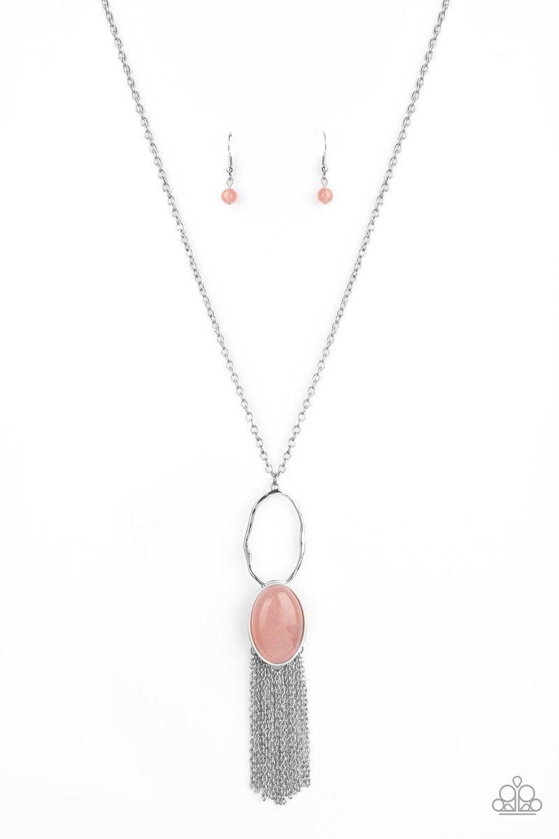 Paparazzi Accessories Dewy Desert - Pink Nestled in a sleek silver frame, a dewy pink stone swings from the bottom of a hammered silver hoop at the bottom of a shiny silver chain. Dainty silver chains stream from the bottom of the tranquil stone pendant,