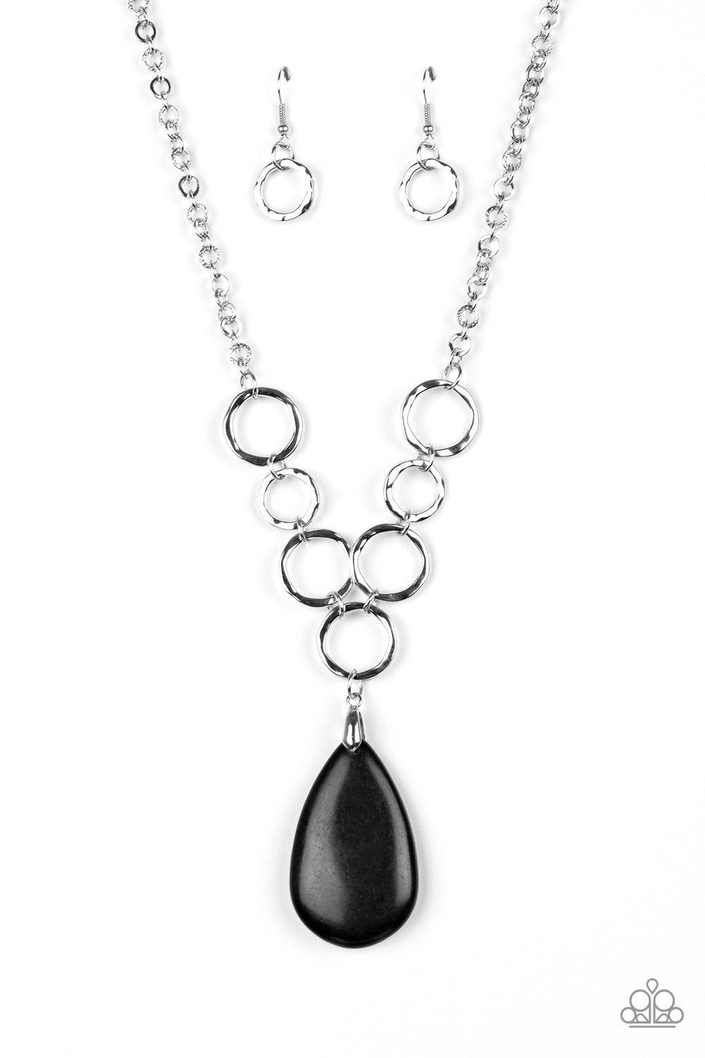 Paparazzi Accessories Livin On A Prairie - Black A collection of silver links give way to an earthy black stone teardrop, creating a tranquil pendant below the collar. Each silver ring is hammered in texture, adding an artisanal touch to the piece. Featur