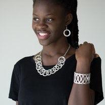 Paparazzi Accessories The Main Contender - Silver Etched and hammered in linear and diamond-cut shimmer, glistening silver circles interlock into a bold industrial chain below the collar. Features an adjustable clasp closure Jewelry