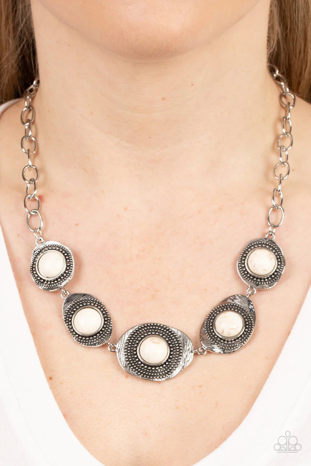 Paparazzi Accessories Homestead Harmony - White Refreshing white stones dot the centers of wavy irregular-shaped frames. Embellished with studded and etched feathery texture, the rustic frames create an earthy artisanal display below the collar. Features