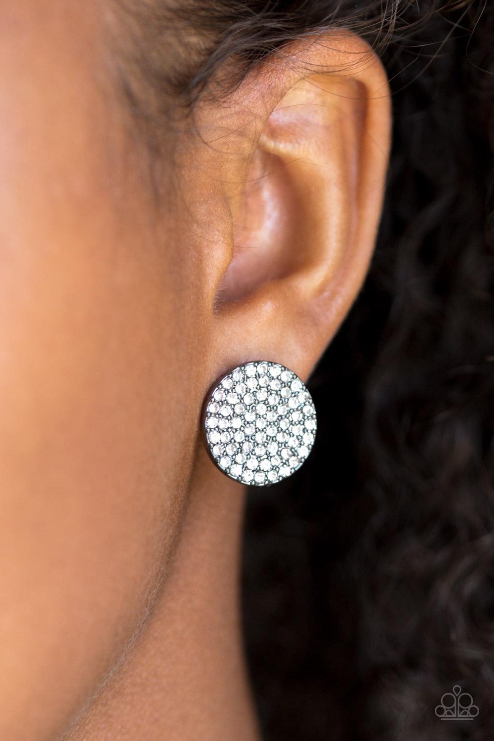Paparazzi Accessories Radiant Ripples - Black A glistening gunmetal frame is encrusted in countless white rhinestones, creating out of this world sparkle. Earring attaches to a standard post fitting. Jewelry