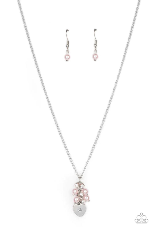 Paparazzi Accessories Pop It and LOCKET - Pink Dotted with a dainty white rhinestone, a shiny silver heart swings from the bottom of a bubbly cluster of pink pearls and white rhinestones, creating a locket inspired pendant below the collar. Features an ad