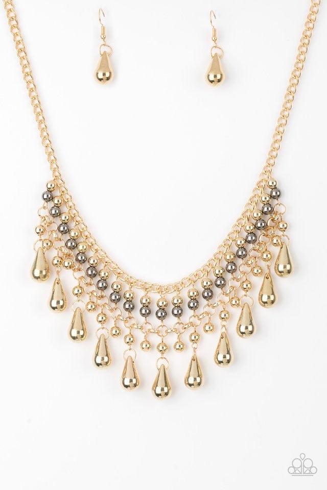 Paparazzi Accessories Don’t Forget To BOSS! - Gold Threaded along metallic rods, stacked gold and gunmetal beads give way to shimmery gold teardrops. The edgy fringe flawlessly drapes beneath the collar, creating a sassy tapered fringe. Features an adjust