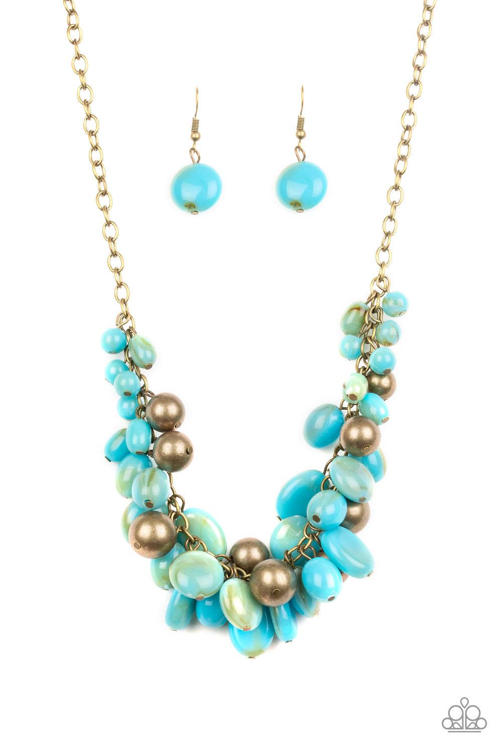 Paparazzi Accessories Full Out Fringe - Blue Featuring a smoky finish, a collection of blue acrylic beads and antiqued brass beads dangle from a classic brass chain, creating a flirtatiously clustered fringe below the collar. Features an adjustable clasp