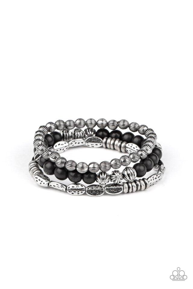 Paparazzi Accessories Trail Mix Mecca - Black An earthy collision of black stones, ornate silver beads and hammered silver accents are threaded along stretchy bands around the wrist, creating colorful layers. Sold as one set of three bracelets. Jewelry