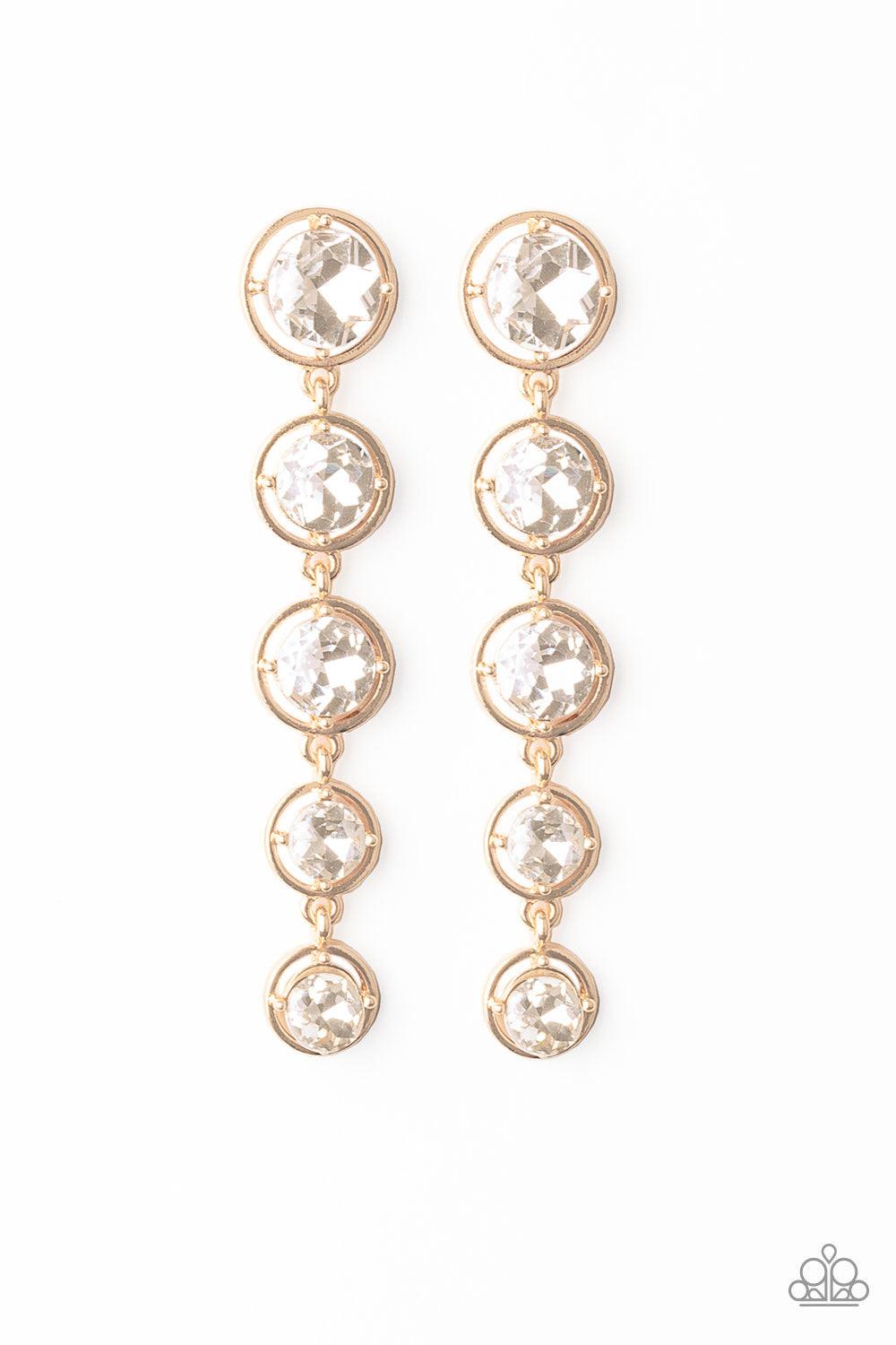 Paparazzi Accessories Drippin In Starlight - Gold Featuring sleek gold fittings, faceted white gems gradually decrease as they trickle from the ear for a glamorous look. Earring attaches to a standard post fitting. Jewelry