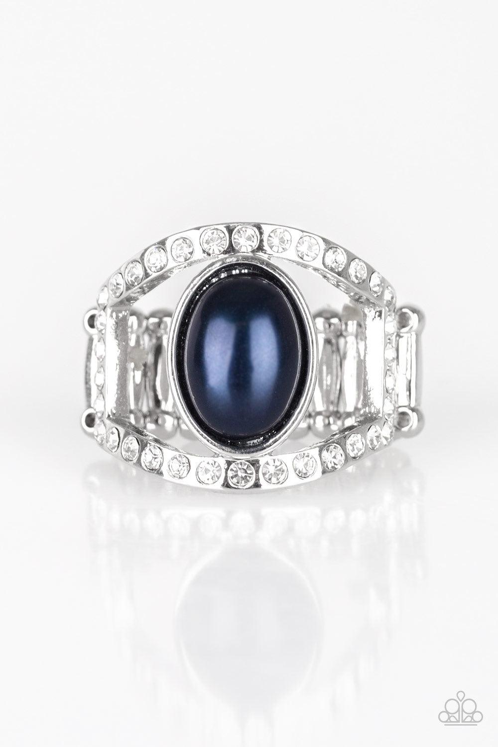 Paparazzi Accessories Radiating Riches - Blue A pearly blue bead sits between two white rhinestone encrusted bands, creating the illusion of a floating centerpiece. Features a stretchy band for a flexible fit. Jewelry