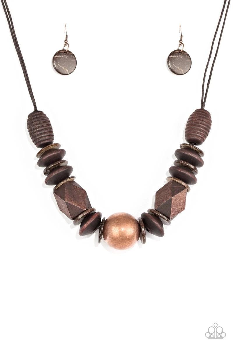 Paparazzi Accessories Grand Turks Getaway - Copper Featuring abstract geometric finishes, mismatched brown wooden beads are threaded along shiny brown cording. A dramatic copper bead adorns the center, creating a bold seasonal look below the collar. Featu