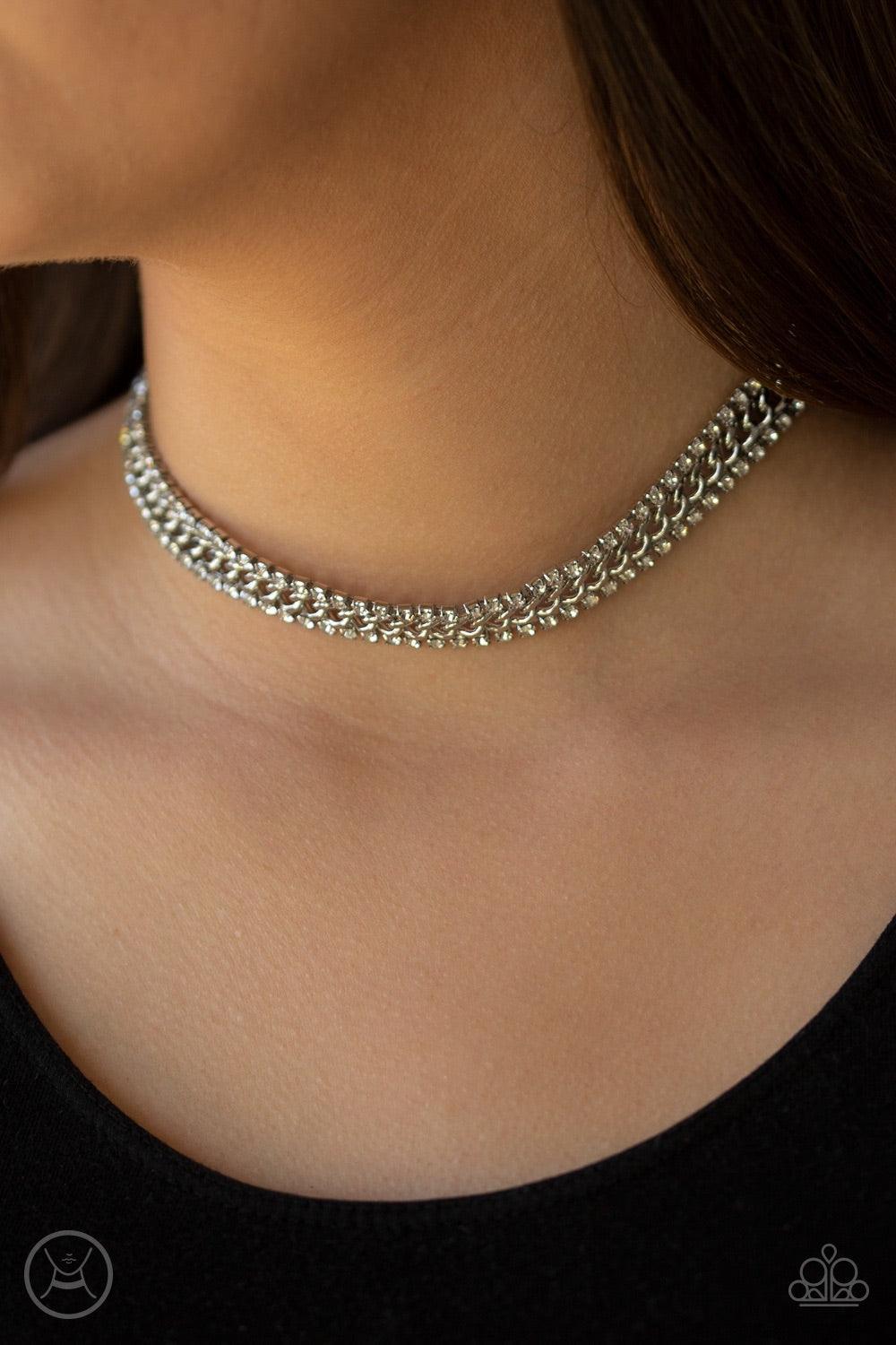 Paparazzi Accessories Empower-HER-ment - White Featuring sleek square fittings, strands of glittery white rhinestones flank a glistening silver chain, coalescing into a regal look around the neck. Features an adjustable clasp closure. Jewelry