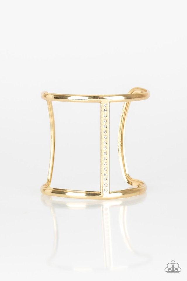 Paparazzi Accessories Diamond Deity - Gold Glassy white rhinestones are encrusted down the spine of an airy gold cuff for an edgy look. Jewelry