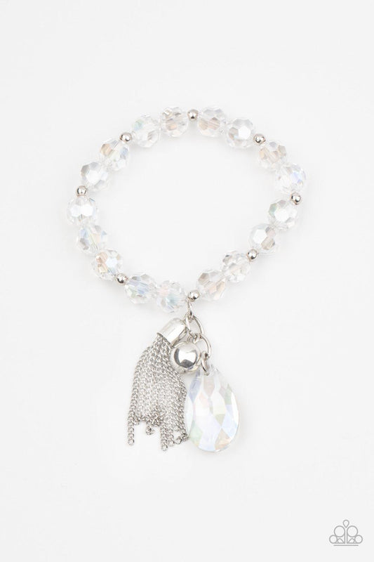 Paparazzi Accessories Leaving So SWOON? - White A collection of dainty silver beads and iridescent faceted crystal-like beads are threaded along stretchy bands around the wrist. A classic silver bead, matching teardrop crystal, and silver chain tassel swi